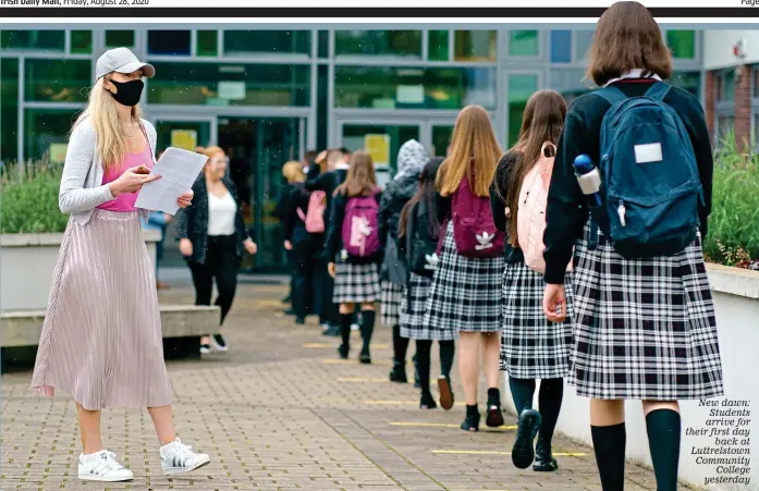  ??  ?? New dawn: Students arrive for their first day back at Luttrelsto­wn Community College yesterday