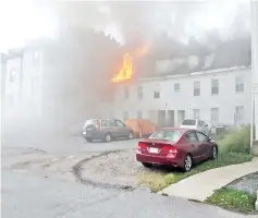  ??  ?? A building burns after a gas explosion in Lawrence, Massachuse­tts in this photo taken from social media by Boston Sparks.— Reuters photos