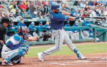  ?? JIM COWSERT THE ASSOCIATED PRESS ?? Toronto Blue Jays' Kendrys Morales hits a three-run homer in the first.