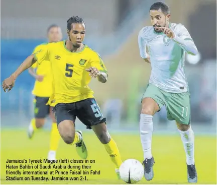  ??  ?? Jamaica’s Tyreek Magee (left) closes in on Hatan Bahbri of Saudi Arabia during their friendly internatio­nal at Prince Faisal bin Fahd Stadium on Tuesday. Jamaica won 2-1.