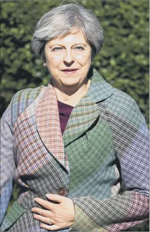  ?? PICTURE: YUI MOK/PA WIRE. ?? BUSINESS AS USUAL: Prime Minister Theresa May arrives for a Macmillan Cancer Support coffee event in Reading yesterday, where she responded to claims of a plot to oust her from Number 10.