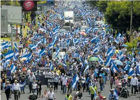  ?? AFP ?? Manifestan­tes durante una marcha llamada ‘Masaya florecerá’.