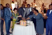  ?? — Supplied photo ?? Officials during the cake-cutting ceremony to commemorat­e the 55th Independen­ce Day of Uganda.