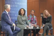  ?? UNIVERSITY MARQUETTE ?? Moderator Mike Gousha listens as panel member Melissa Goins (second from left) speaks during a discussion about revitalizi­ng Milwaukee’s central city. Fellow developers JoAnne Sabir and Juli Kaufmann (right) also were on the panel.