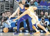  ?? Chris O’Meara Associated Press ?? TENNESSEE forward Olivier Nkamhoua strips the ball from Duke’s Kyle Filipowski in the second half.