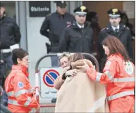  ?? Bobo Antic / Associated Press ?? Relatives and friends comfort each others outside the morgue in Corinaldo, Italy, on Saturday. A stampede at a rap concert in an overcrowde­d disco in central Italy killed six teenagers and a woman who had accompanie­d her daughter to the event early Saturday, police said.