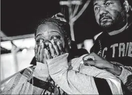  ?? MARCUS YAM/LOS ANGELES TIMES ?? Latrice Radford is consoled Saturday outside the scene of a fatal shooting at the Gable House Bowl in Torrance, Calif. Authoritie­s said seven people were shot, three fatally.