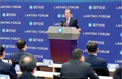  ?? FENG YONGBIN / CHINA DAILY ?? State Councilor and Foreign Minister Wang Yi, speaking in Beijing on Feb 22 at the opening of the Lanting Forum, called for restarting win-win cooperatio­n in China-US ties.