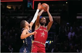  ?? AP PHOTO/DARRON CUMMINGS ?? Phoenix Suns forward Kevin Durant (35) shoots over Indiana Pacers guard Tyrese Haliburton (0) during the first half of an NBA All-Star basketball game in Indianapol­is, Sunday, Feb. 18, 2024.