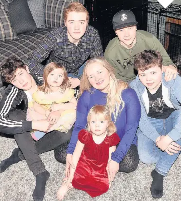  ??  ?? TWIN SETS Karen Rodger with her three sets of twins. From far left, Finn, 15, Isla, three, Lewis, 18, Karen with Rowan, three, Kyle, 18, and Jude, 15. Picture: David Johnstone