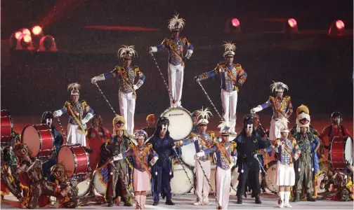  ?? — AP ?? Members of Indonesia’s security forces perform during the closing ceremony of the 18th Asian Games in Jakarta on Sunday.