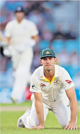  ??  ?? Despairing dive: Mitchell Marsh shows his frustratio­n after failing to stop the ball