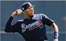  ?? 2017 FILE/ CURTIS COMPTON / CCOMPTON@AJC.COM ?? Infielder Johan Camargo fields a grounder during spring training last year in Lake Buena Vista.