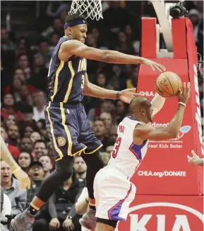  ??  ?? LOS ANGELES: Indiana Pacers’ Myles Turner, top, defends Los Angeles Clippers’ Chris Paul during the second half of an NBA basketball game Sunday, in Los Angeles. The Pacers won 111-102. — AP