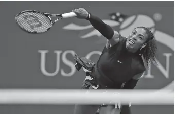  ??  ?? Serena Williams serves to Simona Halep during a quarterfin­al match Wednesday night at the U.S. Open in New York. Williams won 6-2, 4-6, 6-3.