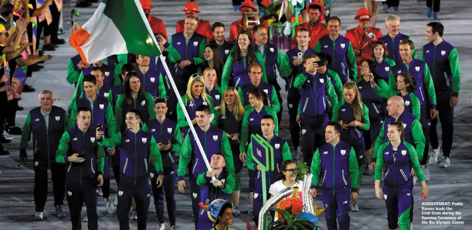  ??  ?? ACHIEVEMEN­T: Paddy Barnes leads the Irish team during the Opening Ceremony of the Rio Olympic Games