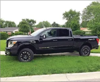  ?? ROBERT DUFFER/CHICAGO TRIBUNE/TNS ?? The 2018 Nissan Titan XD Crew Cab in Pro-4X trim is powered by a 5-liter turbocharg­ed V-8 diesel engine and six-speed automatic Aisin transmissi­on that generates 310 horsepower and 555 pound-feet of torque. It tows 12,640 pounds.