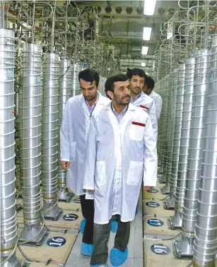  ?? (Photo by the Office of the Presidency of the Islamic Republic of Iran via Getty Images) ?? FORMER IRANIAN president Mahmoud Ahmadineja­d visits the Natanz uranium enrichment facility in April 2008, shortly before its centrifuge­s were destroyed by the Stuxnet virus. Why is responsibi­lity now being taken for attacks and involvemen­t being admitted with bluster and bravado?