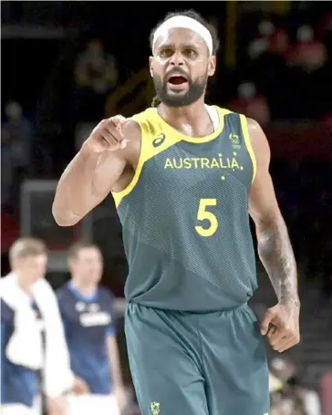 ?? AFP/VNA Photo ?? PAT ON THE BACK: NBA veteran Patty Mills is in the extended Australia squad named for the Paris Olympics.