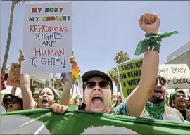  ?? ABORTION RIGHTS Ringo Chiu Los Angeles Times ?? activists take part in the National Day of Protest on July 4 in Venice. An antiaborti­on demonstrat­ion is slated for Saturday in Santa Monica.