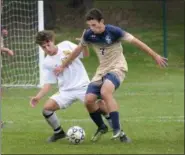  ?? GENE WALSH — DIGITAL FIRST MEDIA ?? La Salle’s Chris Metzler controls the ball as Lansdale Catholic’s Evan Senour defends Friday.