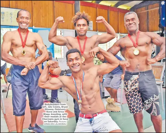  ?? Picture: JONACANI LALAKOBAU ?? Bodybuilde­rs from left, Jale Colata, Bryan Ilitoona, Onisivoro Koroi and Ariva Waqa, kneeling, with their medals at the Charmans gym in Suva on Saturday.