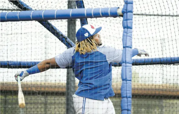  ?? PHOTOS: NATHAN DENETTE / THE CANADIAN PRESS ?? Toronto Blue Jays infielder Vladimir Guerrero Jr. hits at batting practice during spring training in Dunedin, Fla., on Monday.