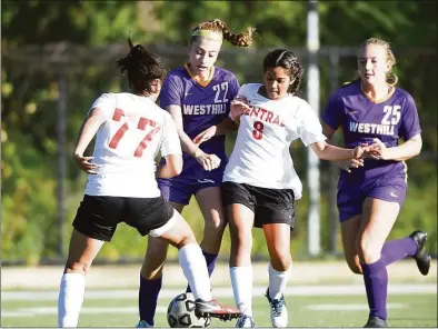  ?? Hearst Connecticu­t Media file photo ?? Westhill’s Audra Hansen (22) battles for the ball with Bridgeport-Central’s Saraya Rosado (77) and Gabriela De Souza (8) at midfield. Westhill defeated Central 5-0 in a FCIAC girls soccer game at Westhill High School on Sept. 17, 2019, in Stamford.