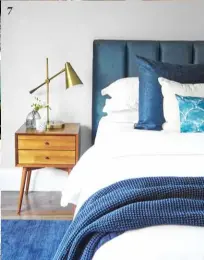  ?? ?? 7 7. In the main bedroom, a headboard upholstere­d in Warwick velvet adds the luxe factor, as do ‘Molten’ brass table lamps from Bloomingda­le’s.