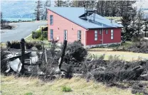  ??  ?? Reprieve . . . A house still stands in the centre of Ohau Village while more than 40 others were destroyed.