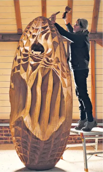  ?? ?? Trunk call Alison Crowther creates an 8ft high sculpture from a 320-year-old oak felled in the South Downs, Sussex. Titled Apology, it will go on display near to where the tree grew.