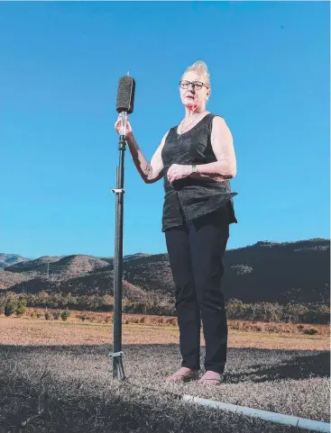  ?? Picture: JUSTIN BRIERTY ?? ON THE BALL: Jennifer Disley, from Walkamin Enterprise­s, at her place opposite the Mt Emerald Wind Farm. She has set up sound and visual monitoring equipment,