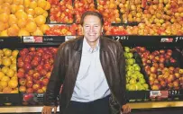  ?? BRYAN ANSELM/THE NEW YORK TIMES ?? Michael Ruhlman, author of Grocery: The Buying and Selling of Food in America, at a ShopRite in Nutley, N.J. His book is a look at how the supemarket is evolving.