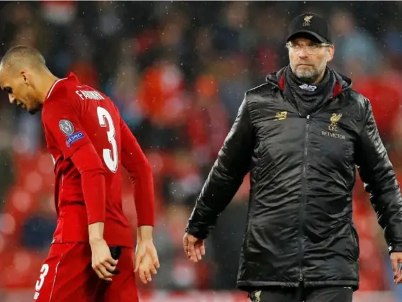  ?? (Reuters) ?? Liverpool manager Jurgen Klopp and Liverpool's Fabinho after the match
