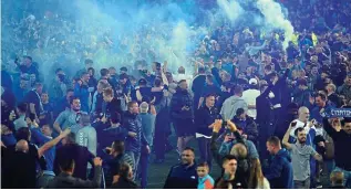  ?? ?? Blow the whistle: Fans invade the pitch at Everton v Crystal Palace last week