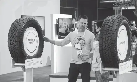  ?? PROVIDED TO CHINA DAILY ?? A tech expert (left) from Goodyear Tire and Rubber Co introduces the functions of a tire product to a visitor at its booth during the Internatio­nal Consumer Electronic­s Show 2024, held in Las Vegas in early January.