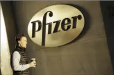  ?? MARK LENNIHAN — THE ASSOCIATED PRESS FILE ?? In this Monday file photo, a man enters Pfizer’s world headquarte­rs, in New York. Pfizer will not split into two publicly traded companies, a decision that, at least for now, ends Wall Street speculatio­n over the drugmaker’s future. The company...