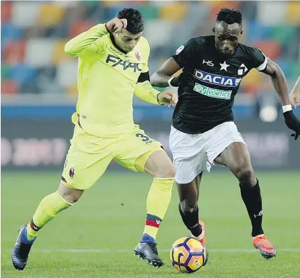  ?? ALBERTO LANCIA /ANSA VIA THE ASSOCIATED PRESS FILES ?? Udinese’s Seko Fofana and Bologna’s Blerim Dzemaili during a Serie A match in Italy. Dzemaili, who will be joining Impact this season, is an attacking midfielder who played for Switzerlan­d at the 2006 and 2014 World Cups and at Euro 2016.