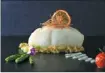  ??  ?? Steamed codfish with leek, lemon sauce and asparagus is a signature dish on the new menu offered by Via Roma.
