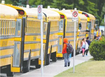  ?? STUART DRYDEN/FILES ?? Annual transporta­tion fees for CBE students could vary from $360 for yellow buses to as high as $750 a year for Calgary Transit youth bus passes during the school year.