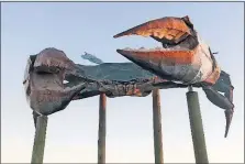  ??  ?? Rockport’s huge “Big Blue Crab” sculpture has been a landmark since the 1960s.