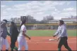  ?? JEANS PINEDA/Taos News ?? The Lady Tigers and Elkettes shook hands after the second game of a doublehead­er on Saturday (April 23).