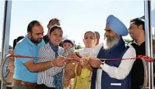  ?? PHOTO: KEVIN FARMER ?? READY TO GO: Preparing to open Ice 'n' Spice at High Street Shopping Centre are (from left) Jasvinder Jammu, Gurpreet Kaur holding son Ekamvir Jammu, Narender Kaur, Jasveer Singh Jammu and Sandip Kumar.