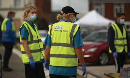  ?? Photograph: Oli Scarff/AFP/Getty Images ?? Workers at a Covid-19 testing centre in Bolton, which has seen a surge in infections. ‘Mr Johnson’s pledges of 500,000 tests a day by the end of October ring hollow in a week when people have been told to drive hundreds of miles to be tested’.