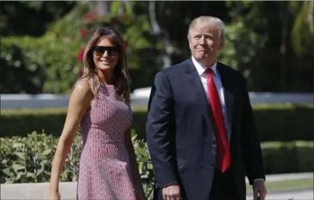 ?? PABLO MARTINEZ MONSIVAIS — THE ASSOCIATED PRESS ?? President Donald Trump and first lady Melania Trump arrive for Easter services at Episcopal Church of Bethesda-by-the-Sea in Palm Beach, Fla., Sunday.