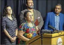  ?? RICARDO B. BRAZZIELL / AMERICAN-STATESMAN ?? Susana Almanza, director of PODER (People Organized in Defense of Earth and Her Resources), is joined Monday at Austin City Hall by other activists at a news conference about a plan to fight gentrifica­tion in East Austin.