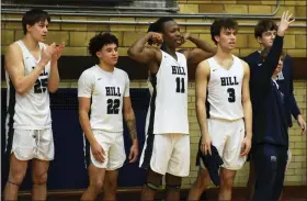  ?? AUSTIN HERTZOG - MEDIANEWS GROUP ?? Hill School starters, from left, Augie Gerhart, Trey O’Neil, Josh Cameron and Justin Molen cheer on teammates during the late stages of their PAISAA first round win over Cristo Rey on Feb. 17 at Hill School.