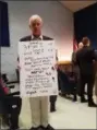  ?? DAN SOKIL — DIGITAL FIRST MEDIA ?? North Penn School District resident Bill Patchell holds a posterboar­d objecting to tax increases during a district facilities forum meeting on Nov. 13.