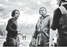  ?? KIMBERLEY FRENCH, TWENTIETH CENTURY FOX ?? Alejandro González Iñárritu directs Leonardo DiCaprio on the set of “The Revenant,” which has 12 Oscar nomination­s.