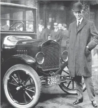  ?? FROM THE COLLECTION­S OF THE HENRY FORD AND FORD MOTOR COMPANY ?? Henry Ford with a 1921 Model T.
